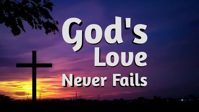 bible words about gods love never fails with jesus cross and   colorful evening background