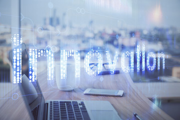Double exposure of desktop computer and technology theme hologram. Concept of software development.