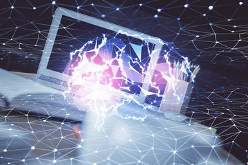 Multi exposure of work space with computer and human brain hologram. Brainstorm concept.