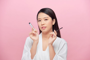 Happy beautiful young woman get ready do make up daily morning routine at home