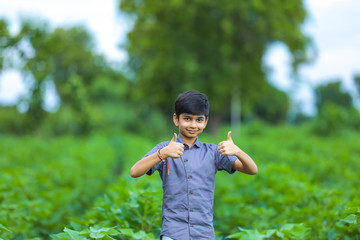Little indian boy showing thumb up