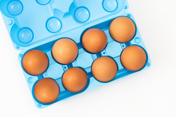 Organic eggs, blue package on the white background.