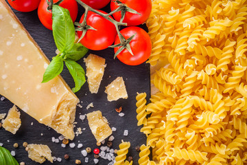 concept of traditional italian pasta with tomatoes and basil