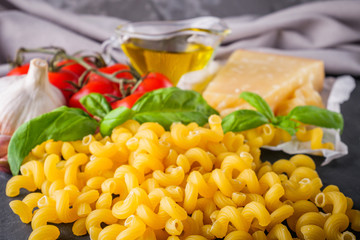 concept of traditional italian pasta with tomatoes and basil