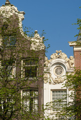 Traditional historic Dutch gable houses beside canal in Amsterdam The Netherlands