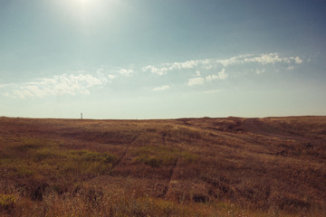 Russia. Travel across Russia. Hills, mountains and fields. Panorama at sunset.