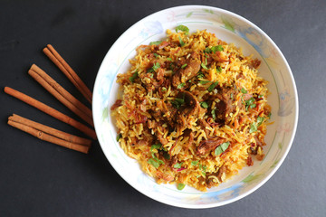 Mutton Biryani or Lamb Pulao. Garnished with fried onion & chopped coriander. Biryani is a famous...