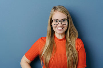 Happy friendly blond woman wearing glasses