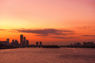 The fantastic and wonderful sunset background blue sky and orange color clouds.