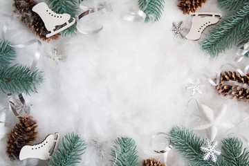 Christmas layout of pine branches and decor in the snow with a copy space