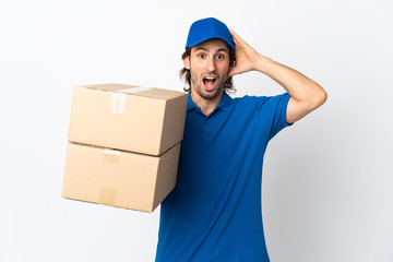 Delivery man isolated on white background with surprise expression