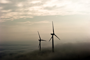 Fototapeta na wymiar Wind generator trails at dawn,in the misty mountain,C