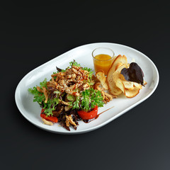 Dishes of traditional Russian cuisine. Restaurant serving. Black background.