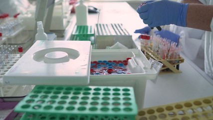 Doctor with test tubes with blood. coronavirus covid 19 is testing, researchers are finding ways to eliminate the corona virus vaccine. Blood tests for Covid virus research experts with a test tube