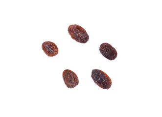 Top view of dried raisins isolated on white background.