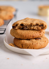 Oatmeal cookies with raisins and nuts on a white background.