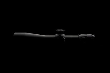 Modern sniper scope on a dark back. Optical device for aiming and shooting at long distances.