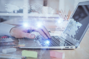 Social network theme hologram with businessman working on computer on background. Concept of world wide web. Multi exposure.