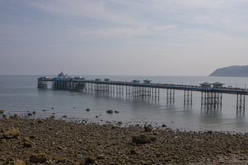 Obraz premium Llandudno pier in sumer. North Wales tourist destination. Old victorian pier
