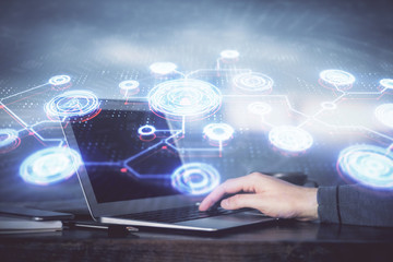 Social network theme hologram with businessman working on computer on background. Concept of world wide web. Multi exposure.