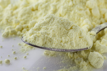 purified sulfur powder on a white acrylic background