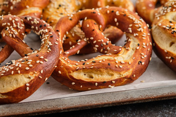 Homemade whole meal pretzels with sesame and salt. Oktoberfest.