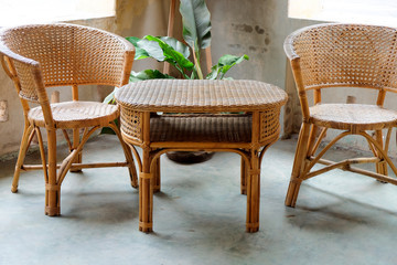 Image of Interior decorative for living area with rattan armchair and plants