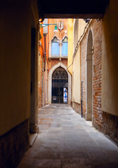 Fototapeta premium Italian Narrow Street with Hallway . Traditional Medieval Street in Venice