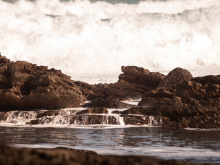 Sea water running over rocks