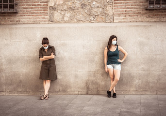 two woman keeping social distancing. Coronavirus COVID-19 protection