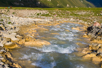 Mountain river, water and red rocks