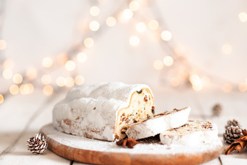 Christmas stollen on wooden background. Traditional Christmas festive pastry dessert. Stollen for...