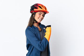 Young cyclist brazilian girl isolated on white  background proud and self-satisfied