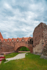 Fototapeta na wymiar The ruins of the teutonic order castle in Torun, Poland. Brick construction built in 13th century. Part of the medieval town of Thorn, one of the World Heritage of Poland next to Vistula river.