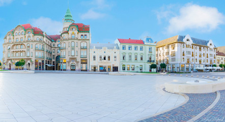 Union square (Piata Unirii) in Oradea, Romania. Blue summer sky. - obrazy, fototapety, plakaty