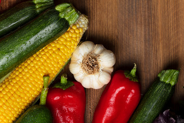 Fresh organic vegetables on wooden background. healthy eating concept. food background.
