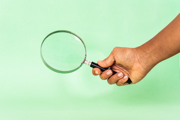 magnifying glass in hand