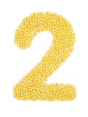 Arabic numeral 2 from grain of millet on isolated white background.
