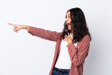 Spanish Chinese woman over isolated white background pointing finger to the side