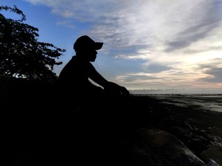 silhouette of a man on the beach