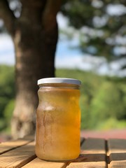 apple cider vinegar in jar on wooden table