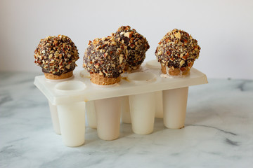 Ice cream cone with chocolate and nuts