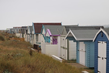 Fototapeta na wymiar Hunstanton beach huts for family holidays by the sea 