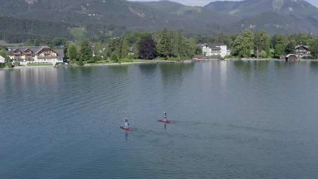 Aerial view from 2 people paddle boarding on Austrian lake
