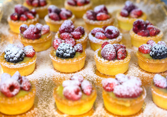 Wild strawberry and raspberry cakes in ancient city of strawberry Nemi, Castelli Romani, Italy