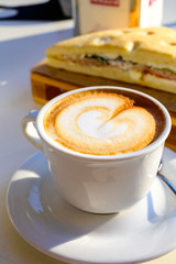 Breakfast coffee, Italian classic cappuccino with milk foam served in cafe