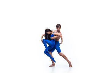 Like child. Couple of modern dancers, art contemp dance, blue and white combination of emotions. Flexibility and grace in motion and action on white studio background. Fashion and beauty, artwork