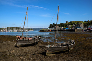Fototapeta na wymiar Old Wooden Small Boats at Tarbert Harbour Scotland