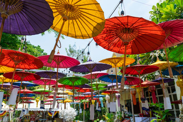 A colorful umbrella hangs in a temple in Chiang Mai.