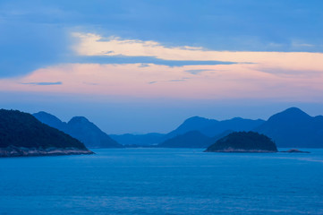 View from Copacabana over the ocean and the hills at sunset, Rio de Janeiro, Brazil
